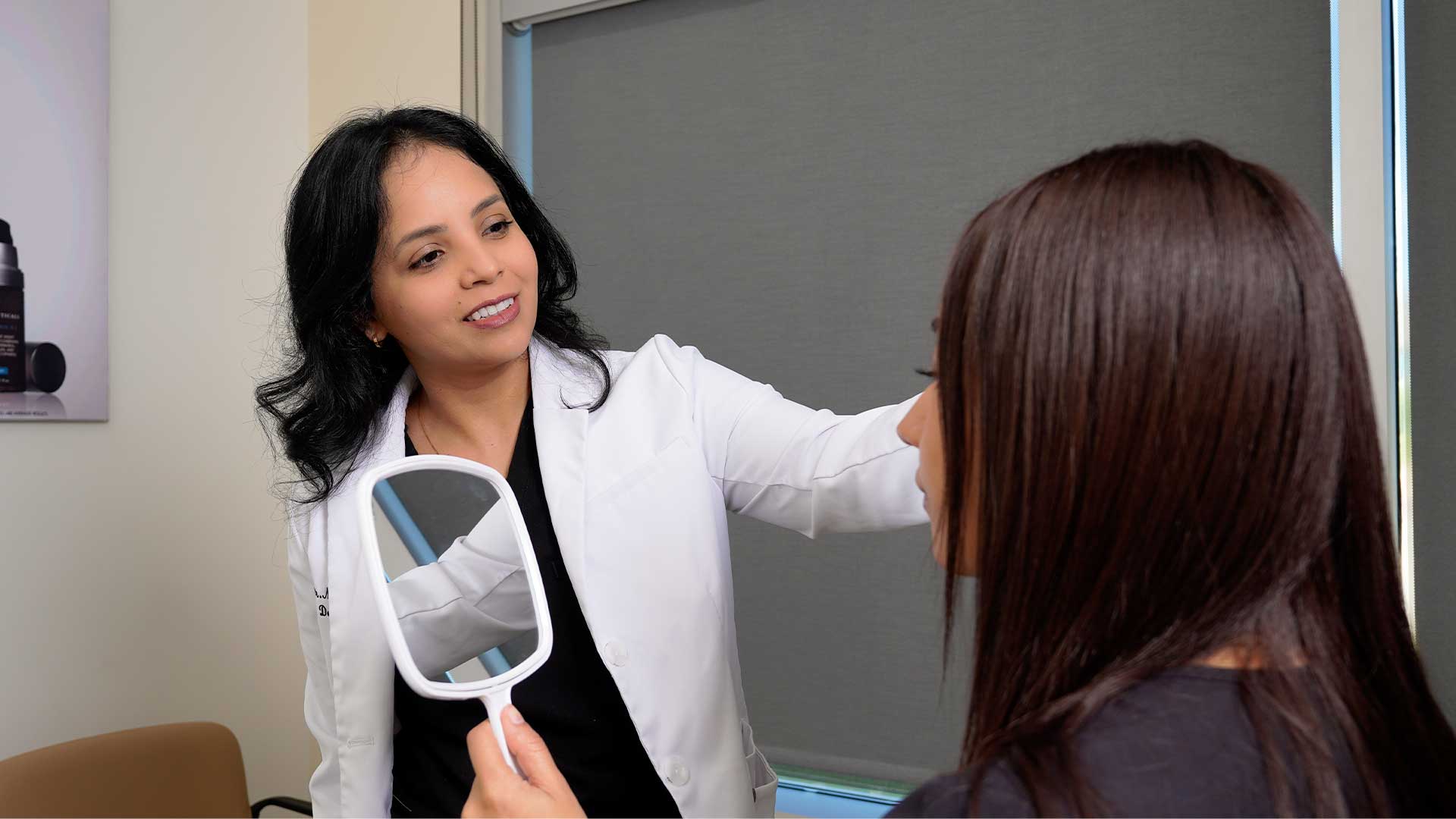 Dr Thomas Consulting With Patient