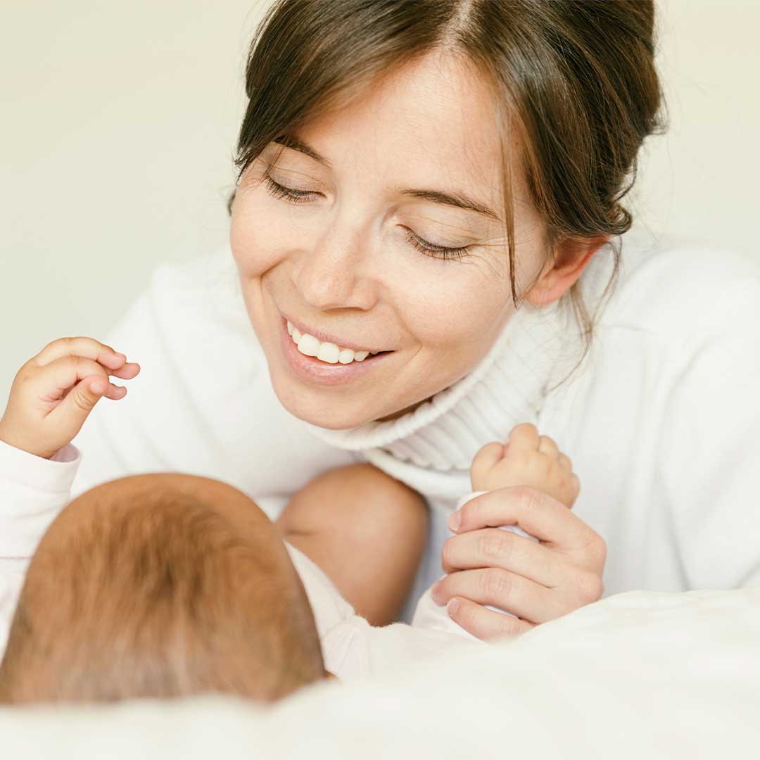 Happy Mom With Newborn Baby