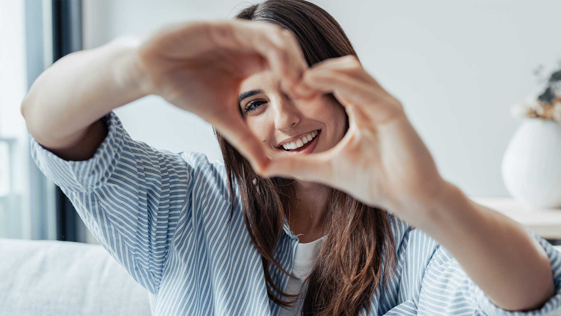 Happy Woman With Heart Sign