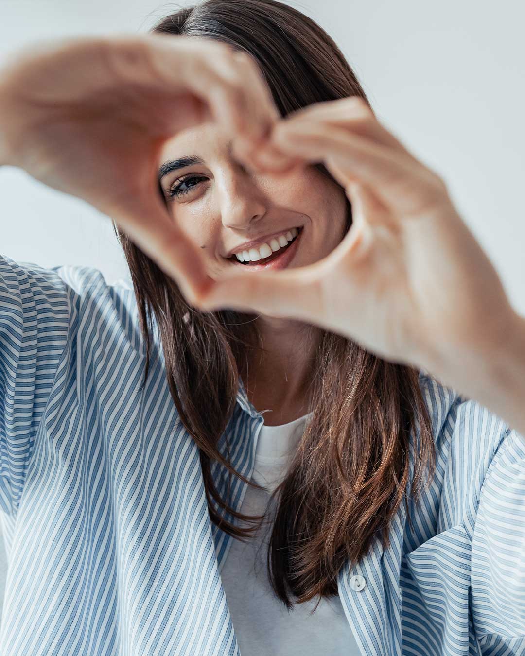 Happy Woman With Heart Sign